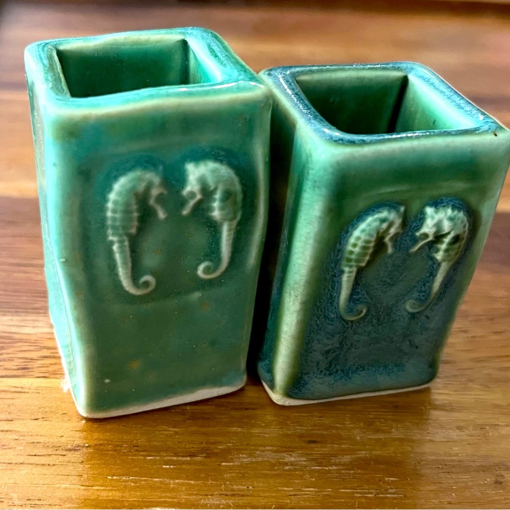 Small ceramic vases with seahorse detail. Green